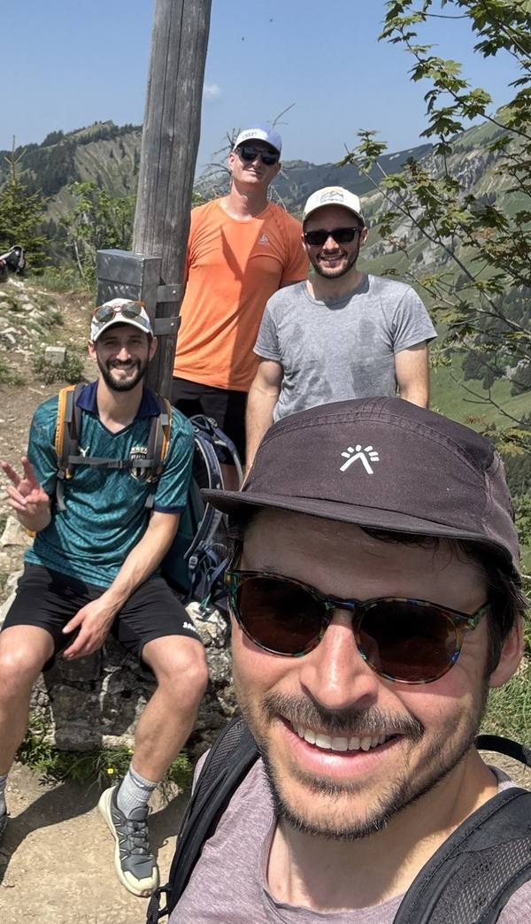 Four team members at the summit during the hiking day